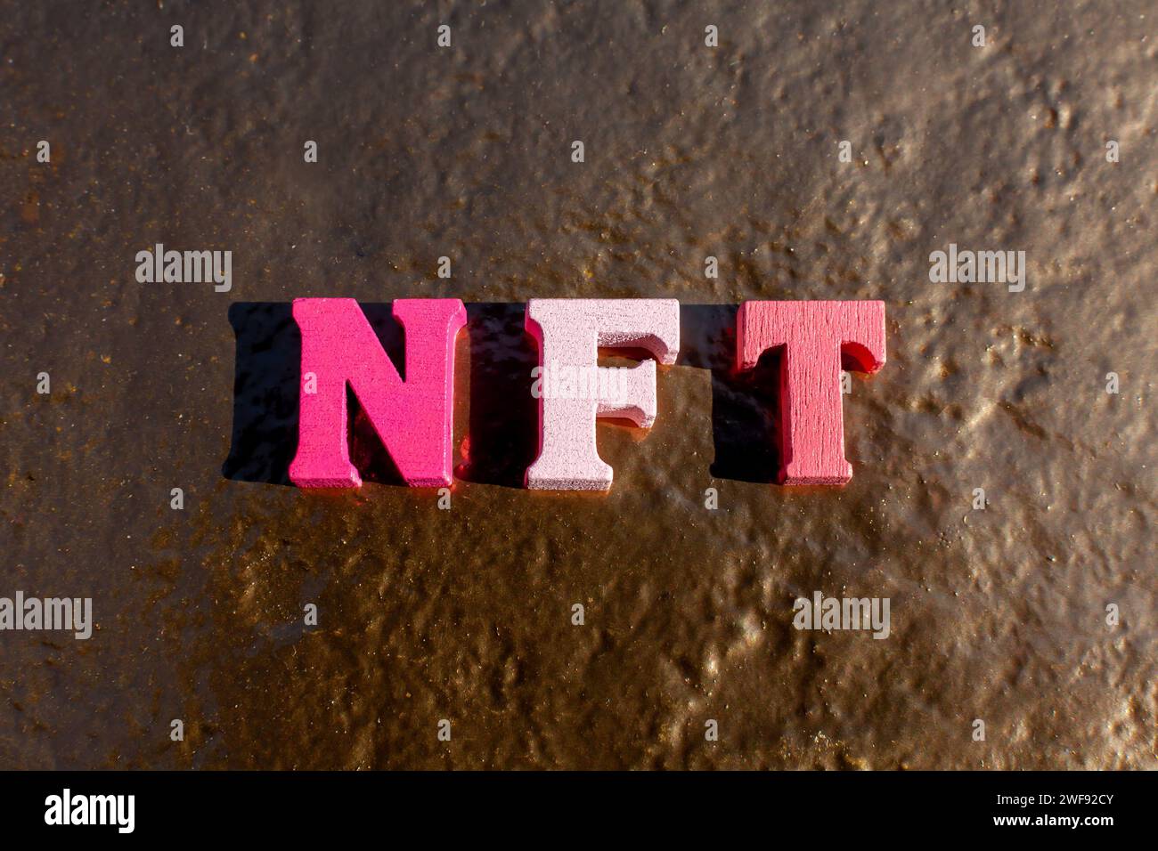 nft letters on gold background Stock Photo - Alamy