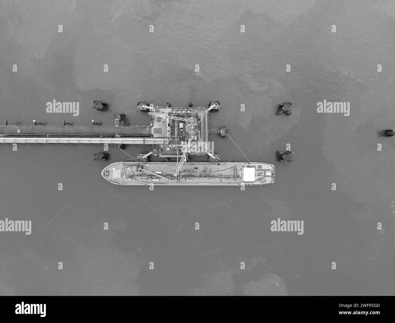 top down view on a inland shipping bulk carrier docked moored at a