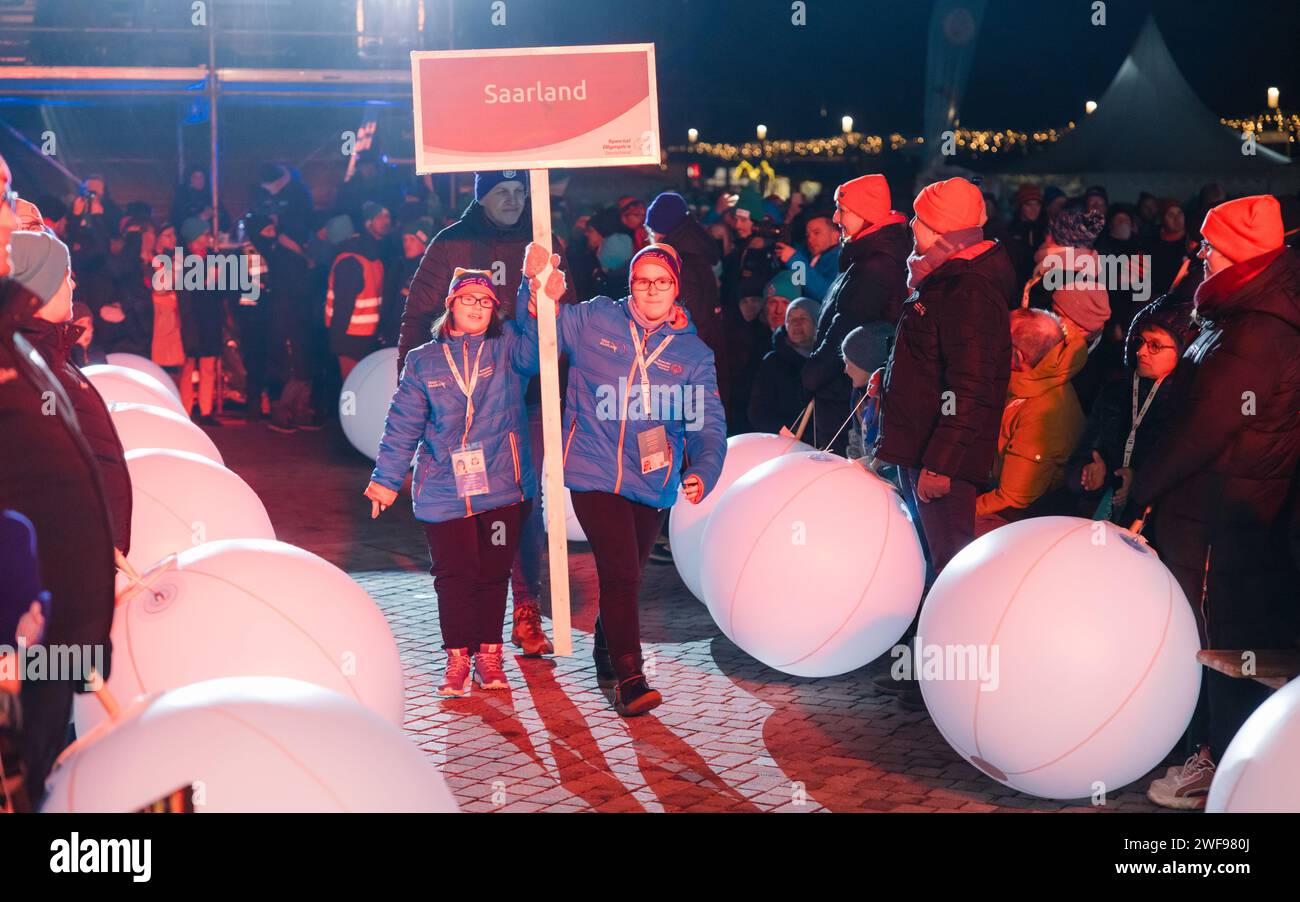 Oberhof, Germany. 29th Jan, 2024. Shield bearers walk through the