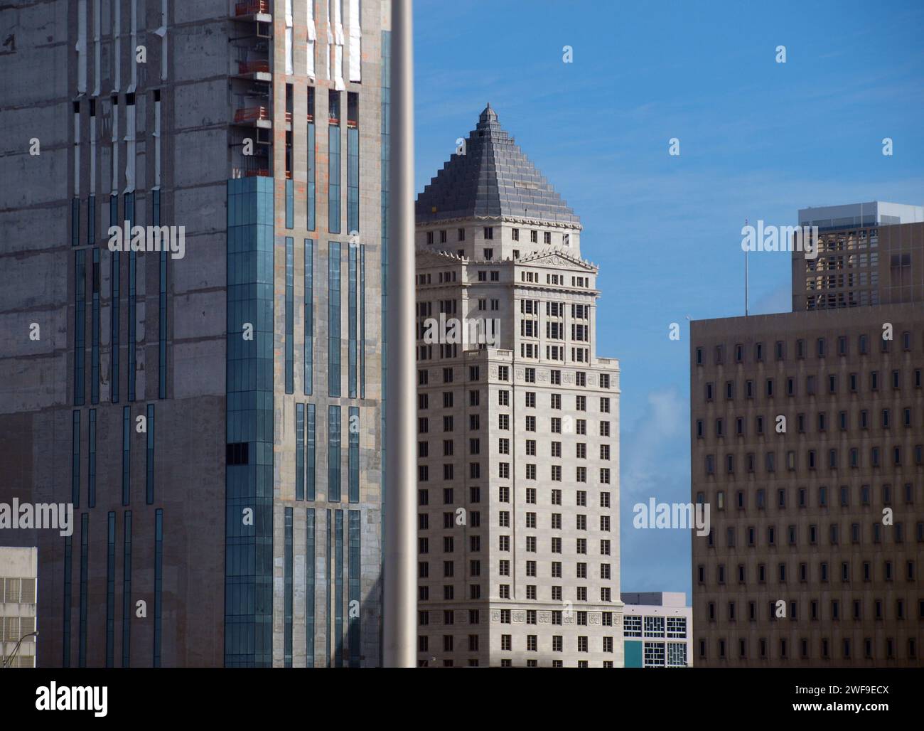 Miami, Florida, United States - January 27, 2024: The historical Miami-Dade County Courthouse skyscraper eclipsed by the new buildings of downtown. Stock Photo
