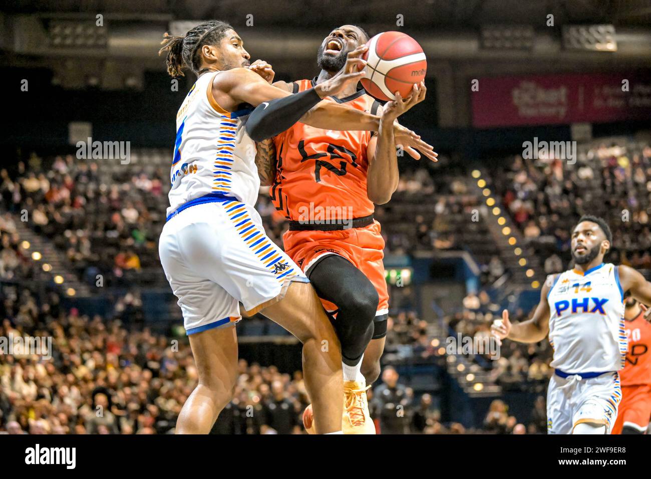 David Nwaba Guard of London Lions Men and Cam Christon Forward of Chester Phoenix Men challenging during the BBL Trophy Final at the Utilita Arena, Birmingham, UK on 28 January 2024. Photo by Phil Hutchinson. Editorial use only, license required for commercial use. No use in betting, games or a single club/league/player publications. Credit: UK Sports Pics Ltd/Alamy Live News Stock Photo