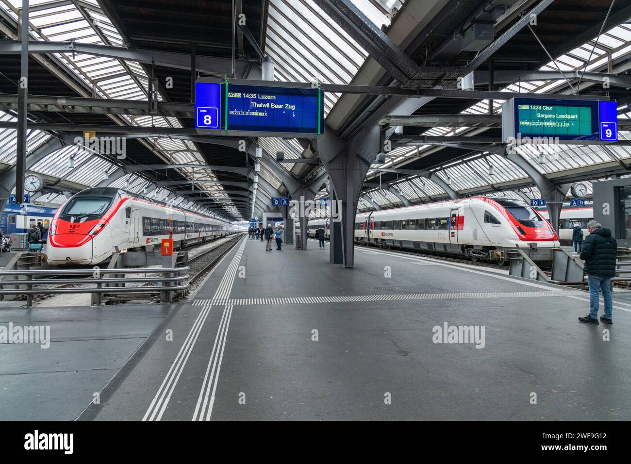 A train arrived at a platform due to depart at Zurich Hauptbahnhof train station in Zurich, Switzerland Stock Photo