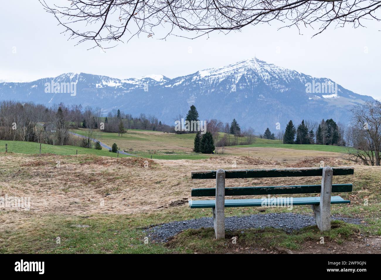 A view from an empty bench in Zugerberg of the Swiss Alps in Switzerland Stock Photo