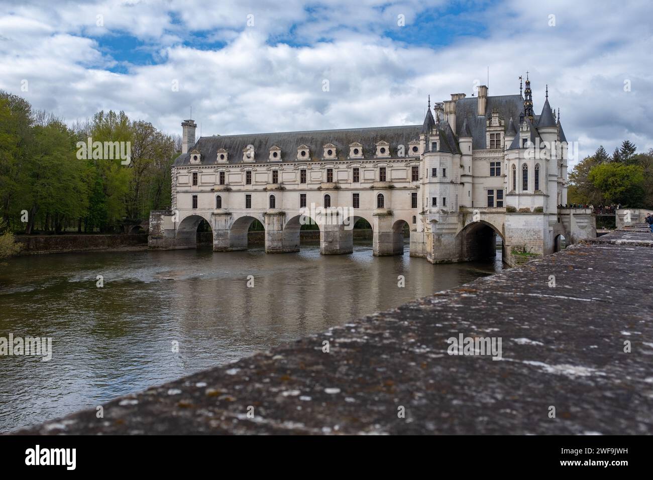 Chenonceau castle taken on a partly overcast spring with unrecognisable people in the background Stock Photo