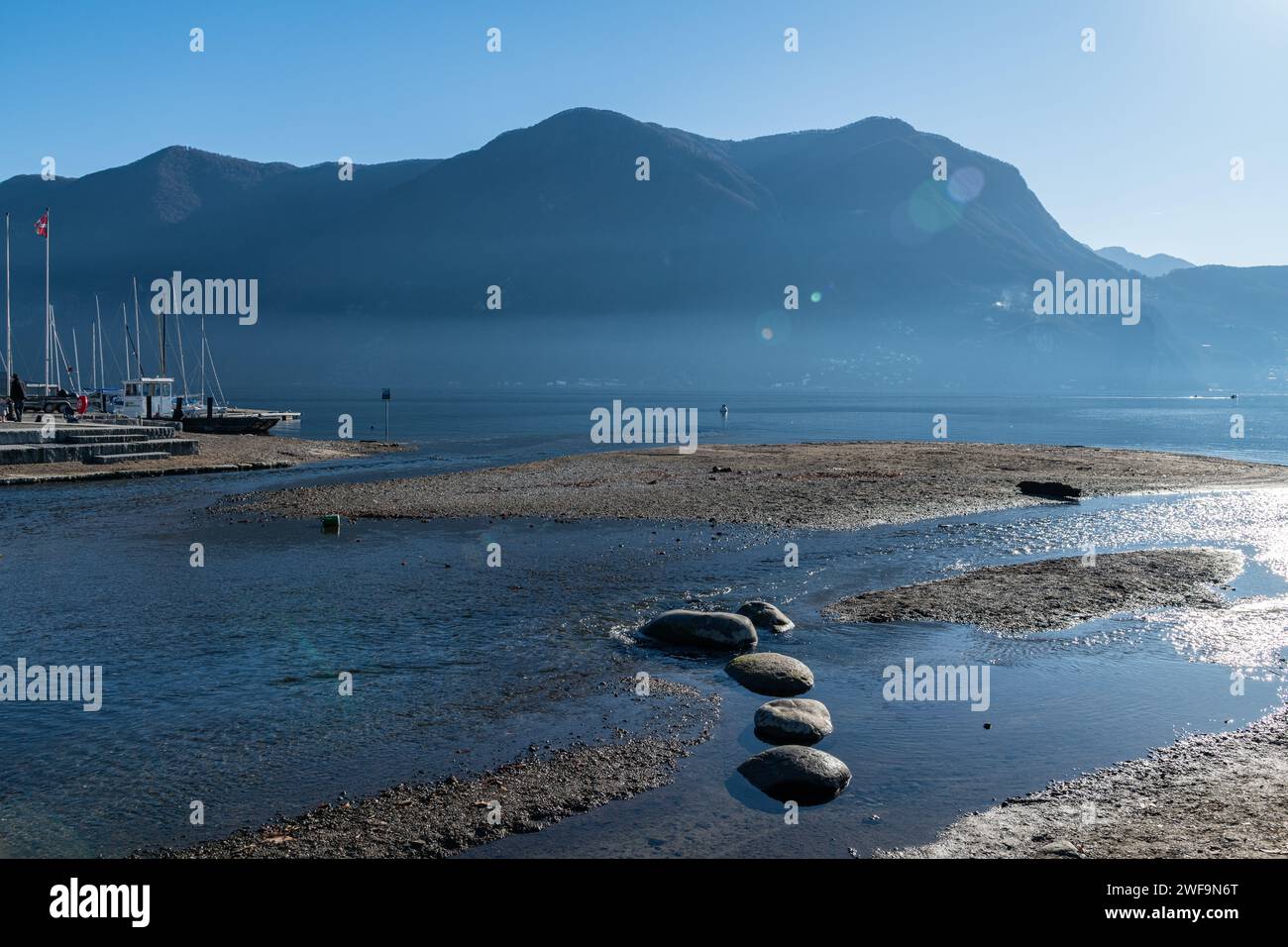 The sandy shore / beach of Lake Lugano in Switzerland Stock Photo