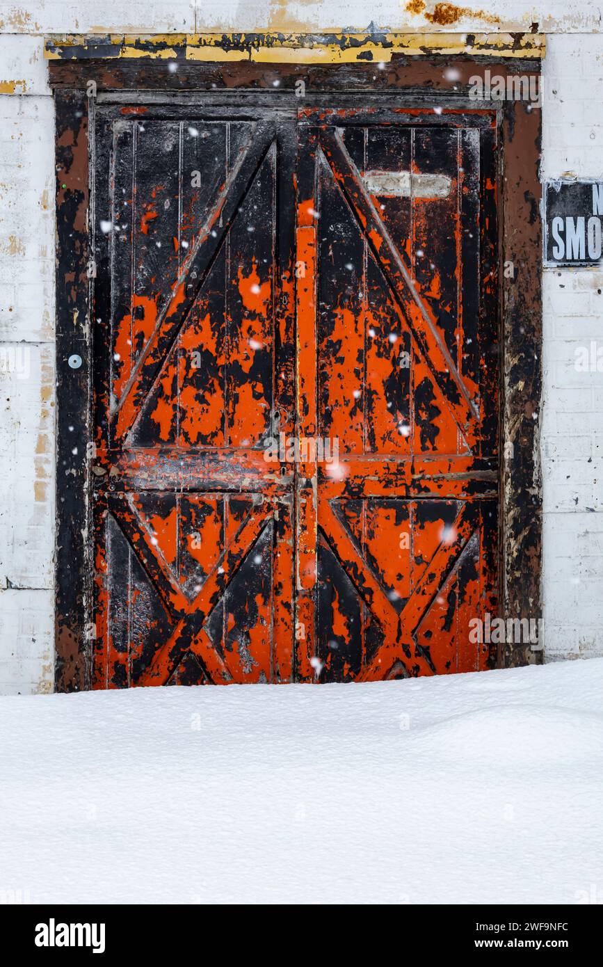 Colorful door on an old grain elevator along the White Pine Trail State Park in Mecosta County, Michigan, USA [No property release; editorial licensin Stock Photo