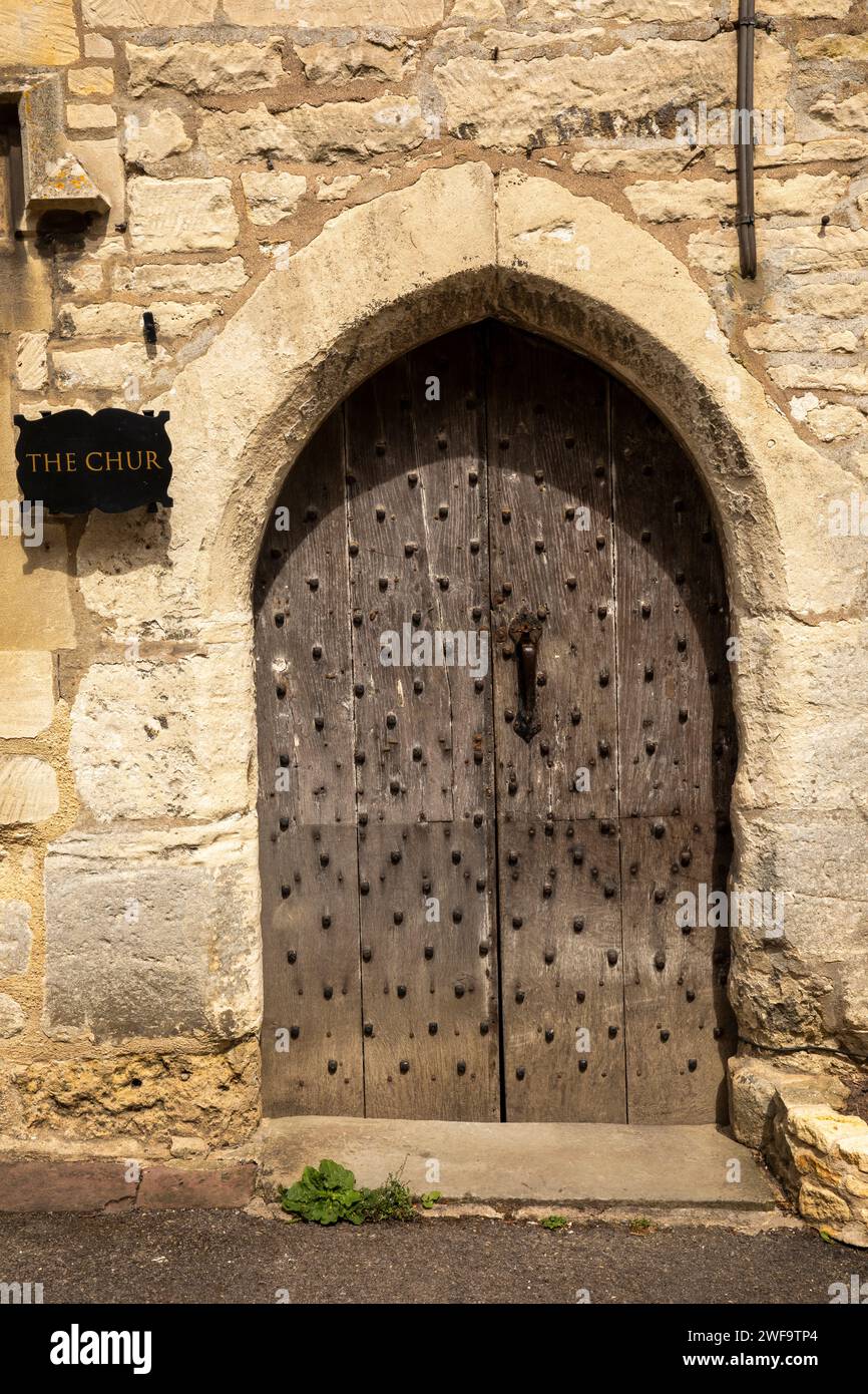 UK, England, Gloucestershire, Painswick, Bisley Street, oldest street, c1300 The Chur house with ancient studded donkey door Stock Photo