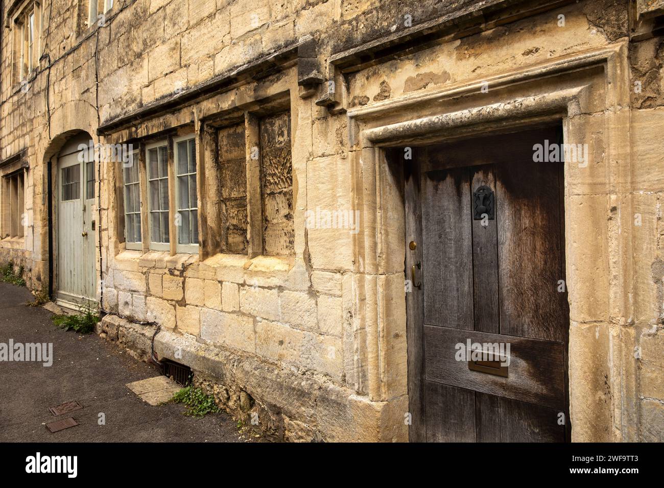 UK, England, Gloucestershire, Painswick, Bisley Street, oldest street, 14th century house with bricked up windows and ancient donkey door Stock Photo