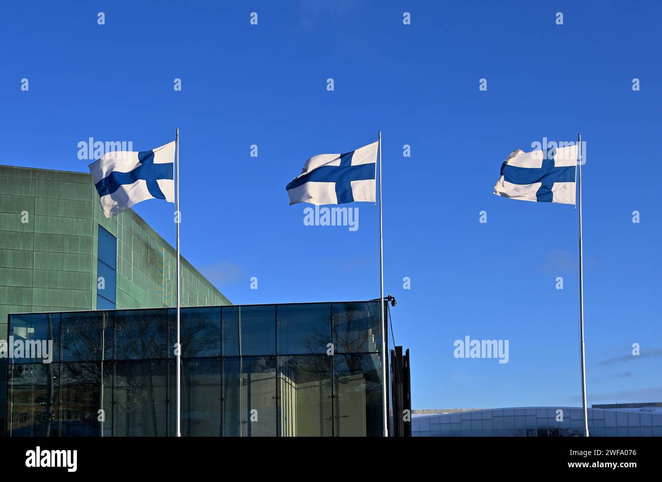 waving national flags of Finland on Finnish Independence Day Stock