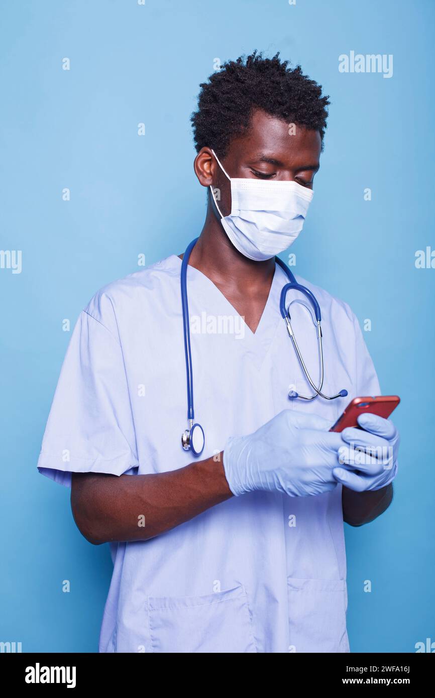 Black man nurse typing hi-res stock photography and images - Alamy