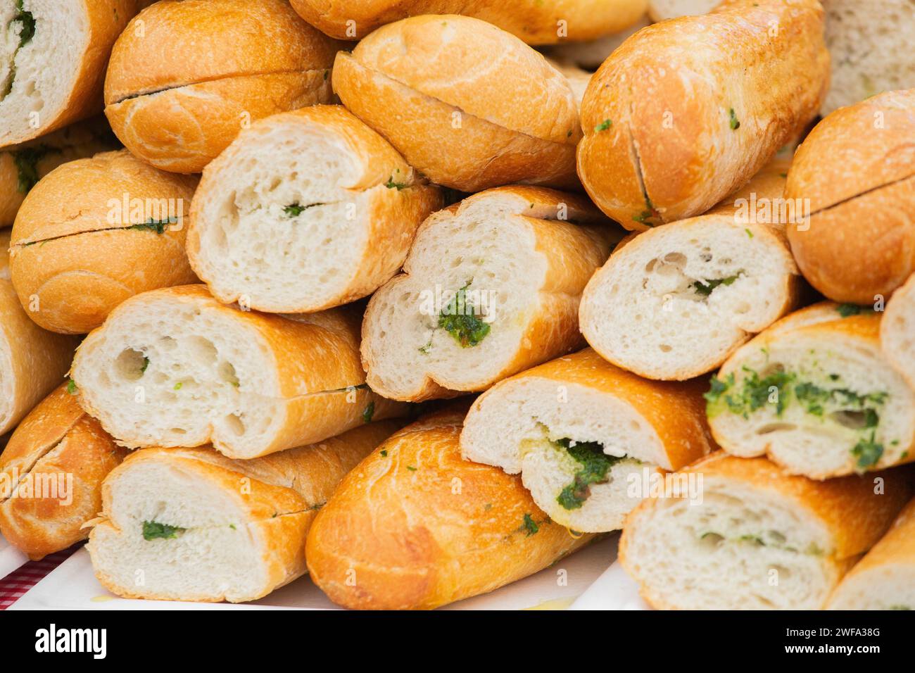 Pile of bread and salsa verde ready to make sandwiches Stock Photo