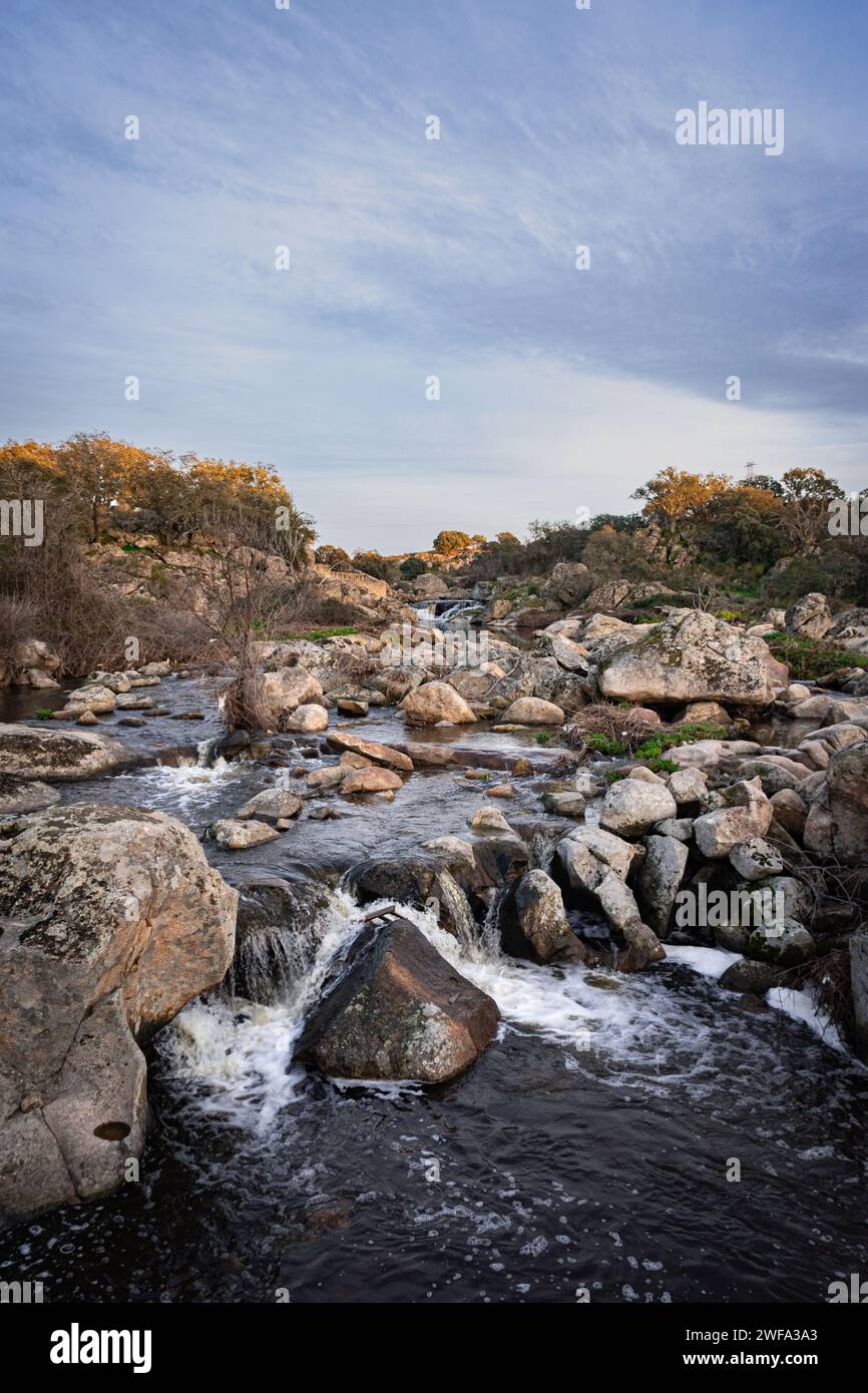 The river Salor flowing towards the reservoir of El Gallo. Stock Photo