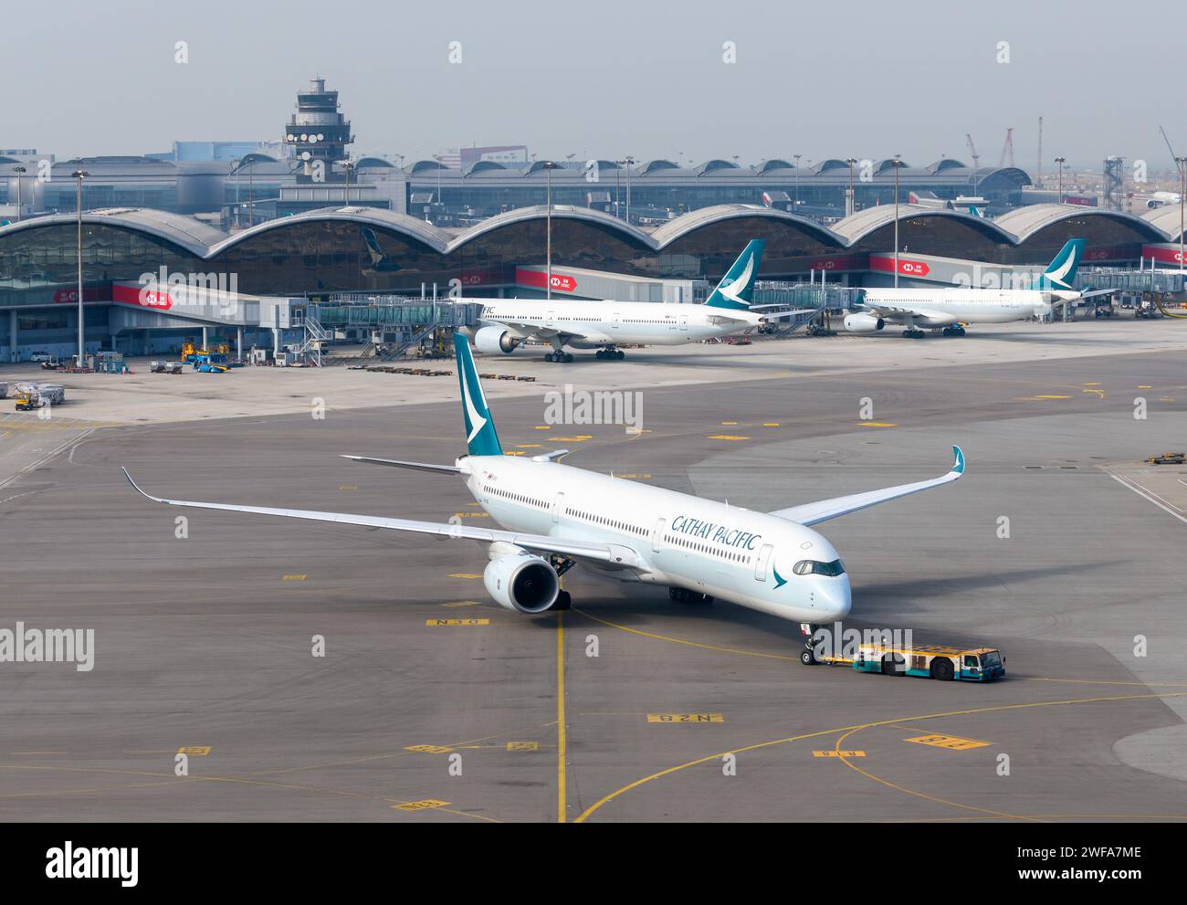 Cathay Pacific Airbus A350 aircraft at Hong Kong Airport. Airplane A350-1000 of Cathay Pacific Airlines during push back at Chek Lap Kok Airport. Stock Photo
