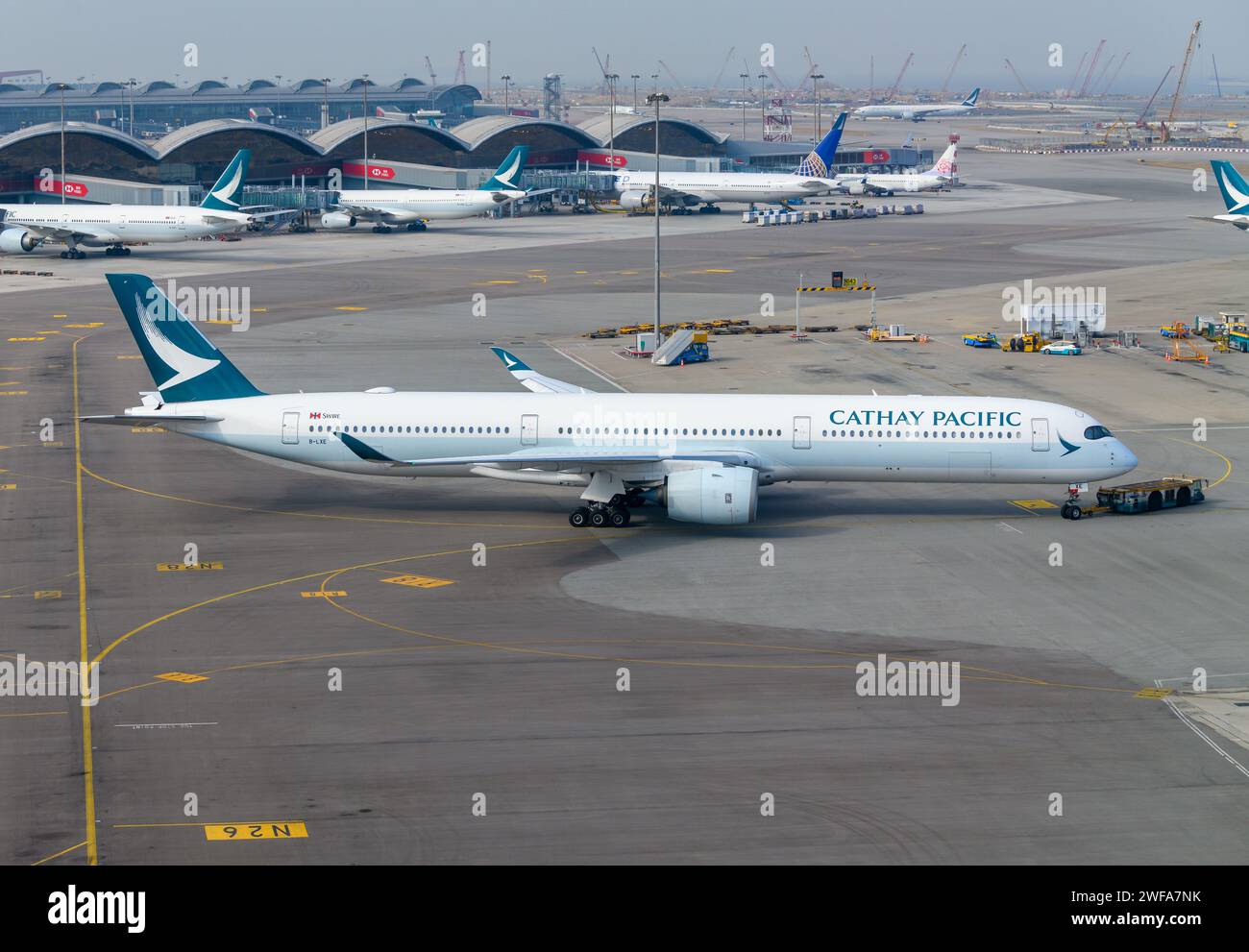 Cathay Pacific Airbus A350 airplane at Hong Kong Airport. Aircraft A350-1000 of Cathay Pacific Airlines during push back at Chek Lap Kok Airport. Stock Photo