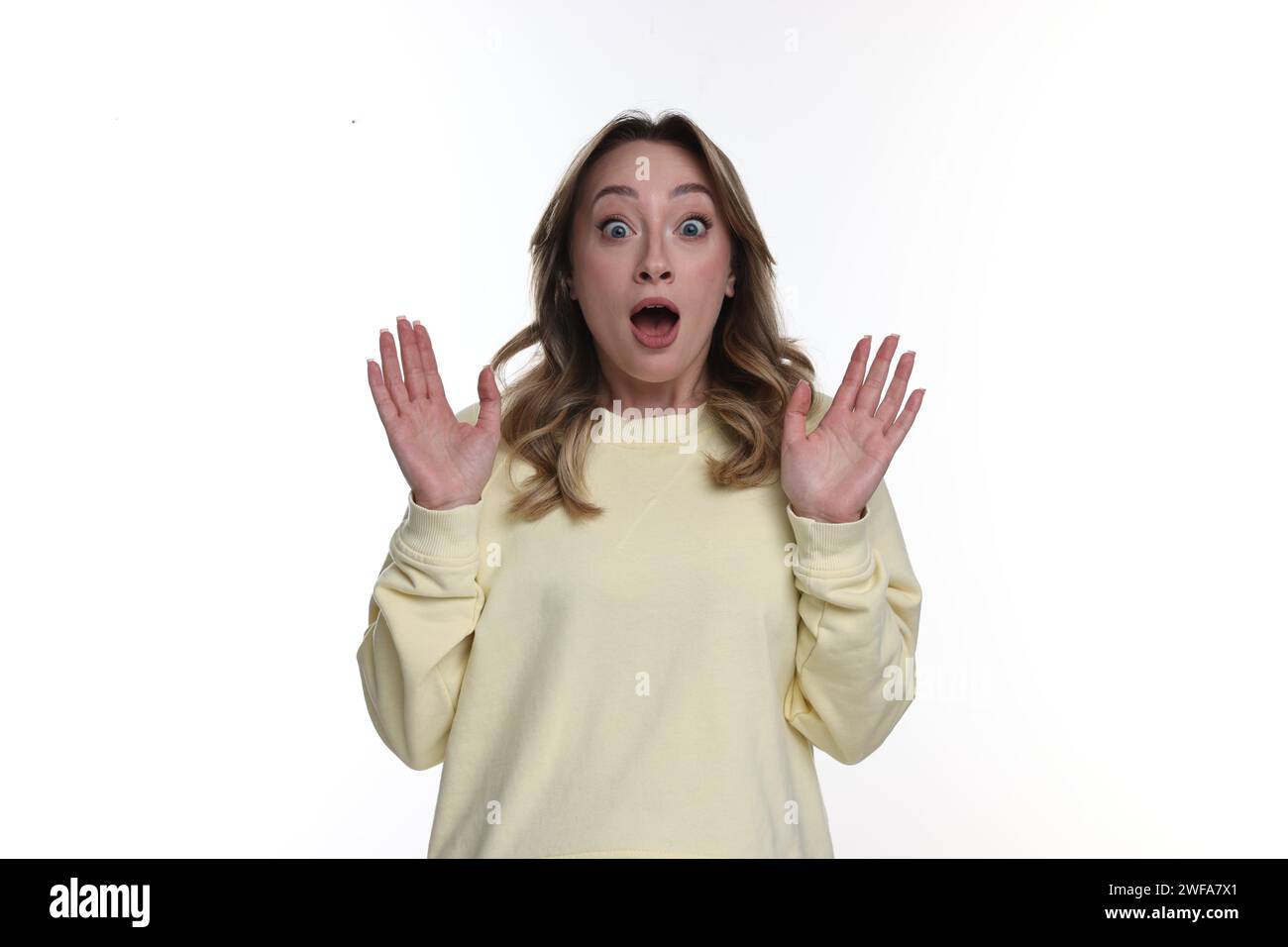 Portrait of surprised woman on white background Stock Photo - Alamy