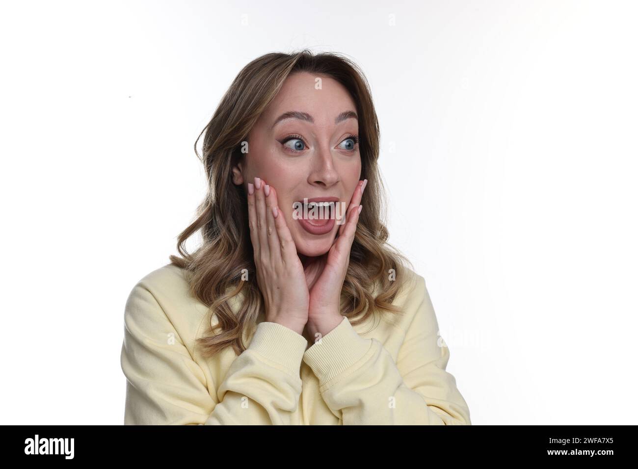 Portrait of happy surprised woman on white background Stock Photo - Alamy