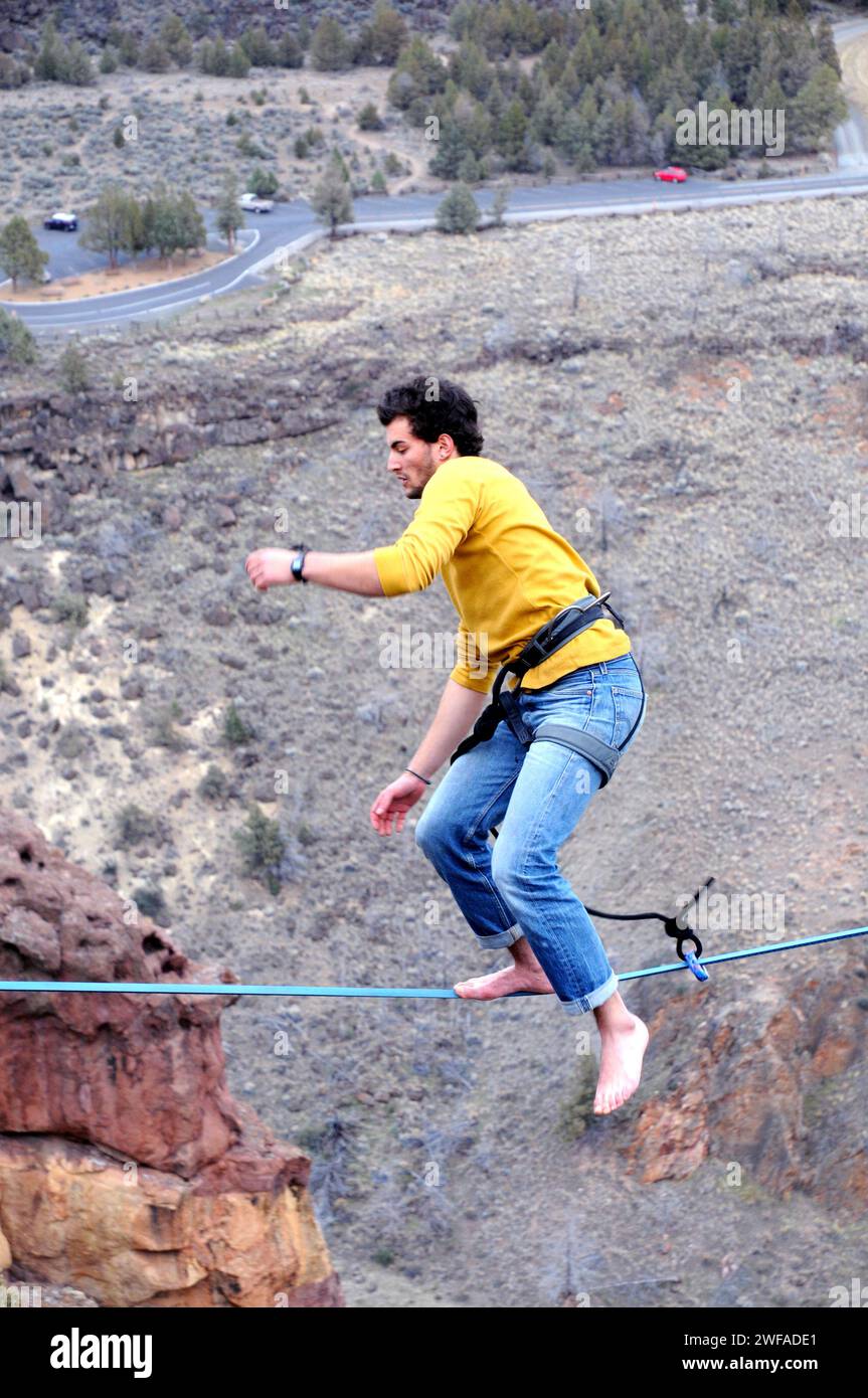 Single male slackline walking in Smith Rock State Park. Central Oregon