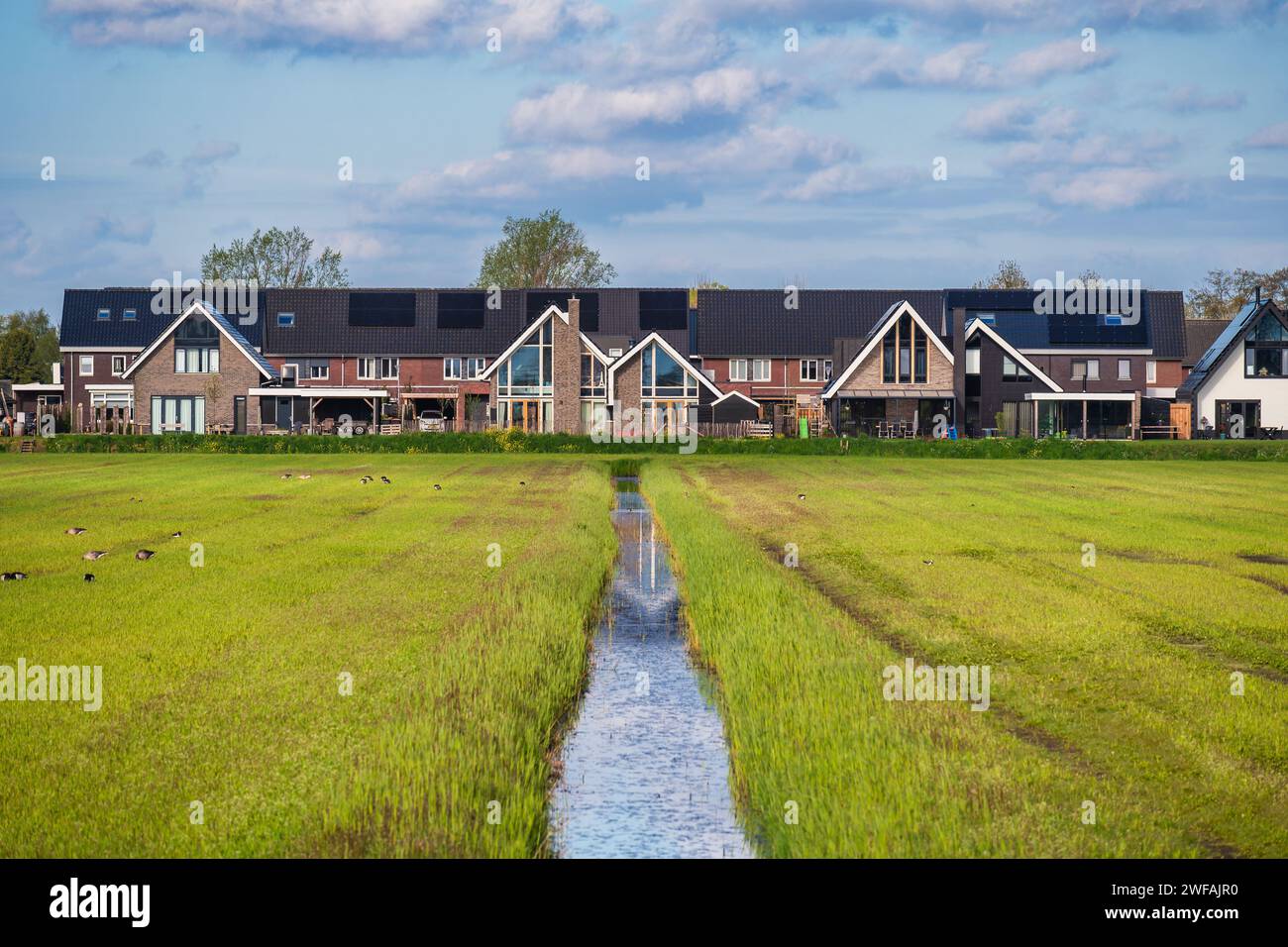 Giethoorn Netherlands, city skyline at canal and traditional house in Giethoorn village Stock