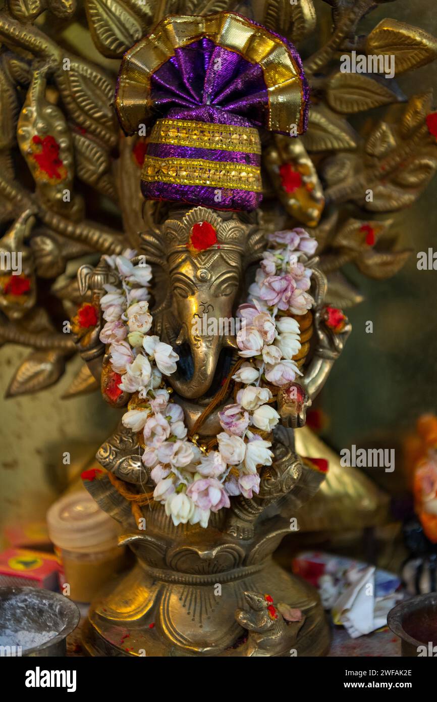 Hindu elephant god Ganesha adorned with a jasmine necklace, India Stock Photo