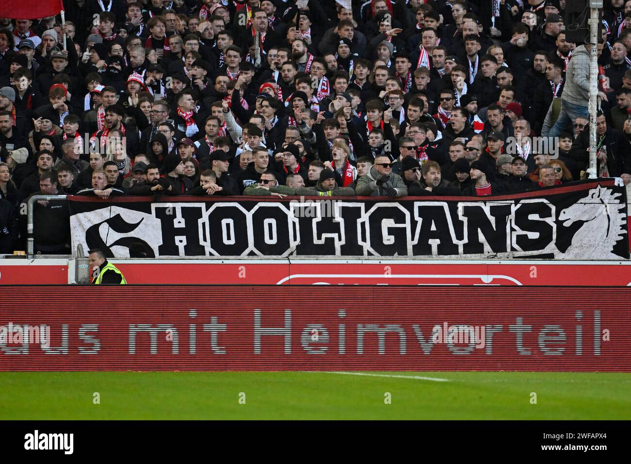 Banner, fan poster, banner, poster, banner, fan campaign HOOLIGANS in front of perimeter advertising WITH HOME ADVANTAGE, Ultras, fan group Stock Photo