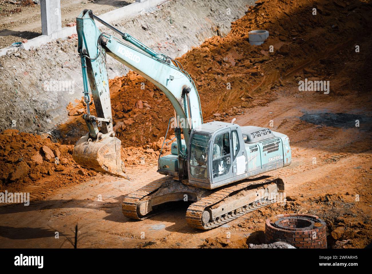 Excavator digging the land Stock Photo Alamy