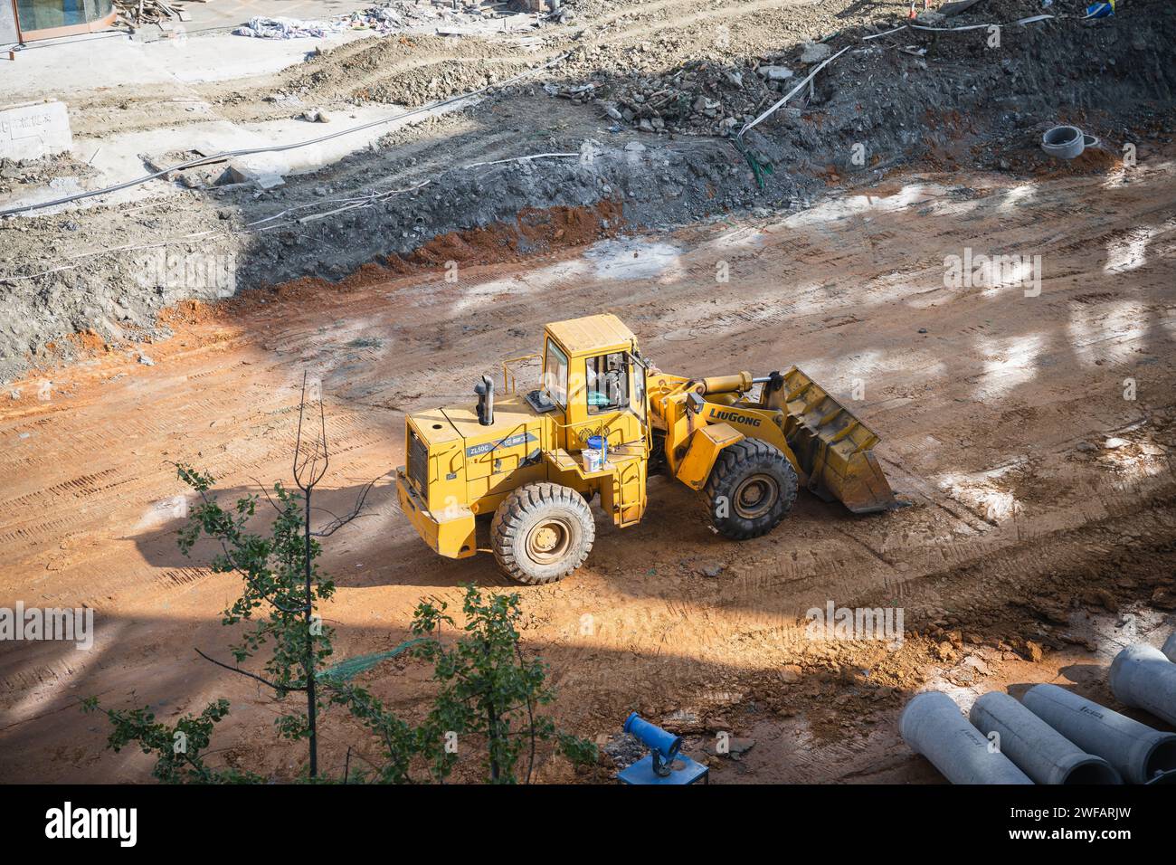 Excavator digging the land Stock Photo Alamy