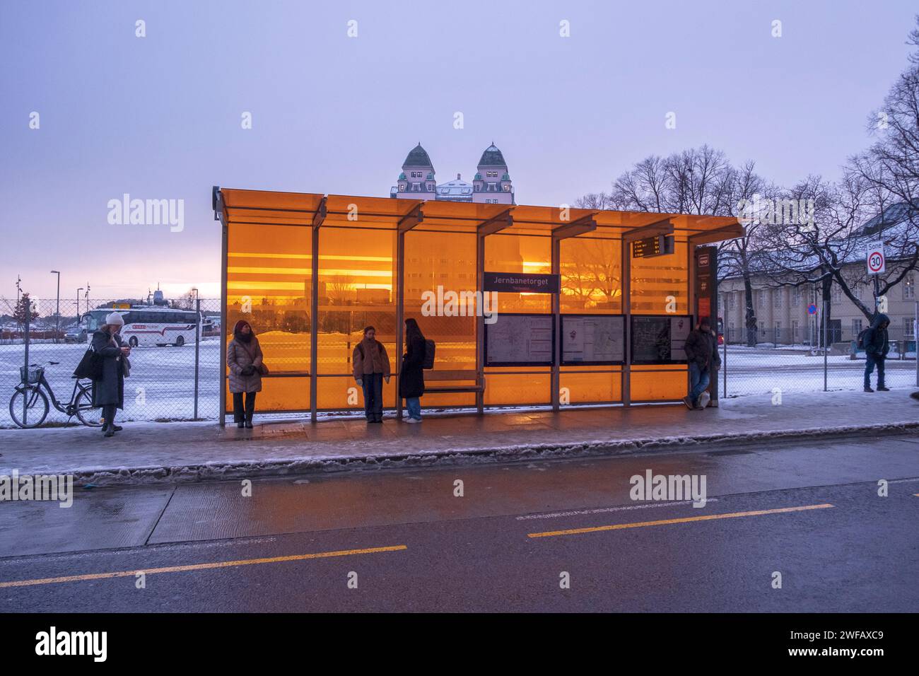 People waiting at a bus stop in central Oslo, Norway, in the winter Stock Photo