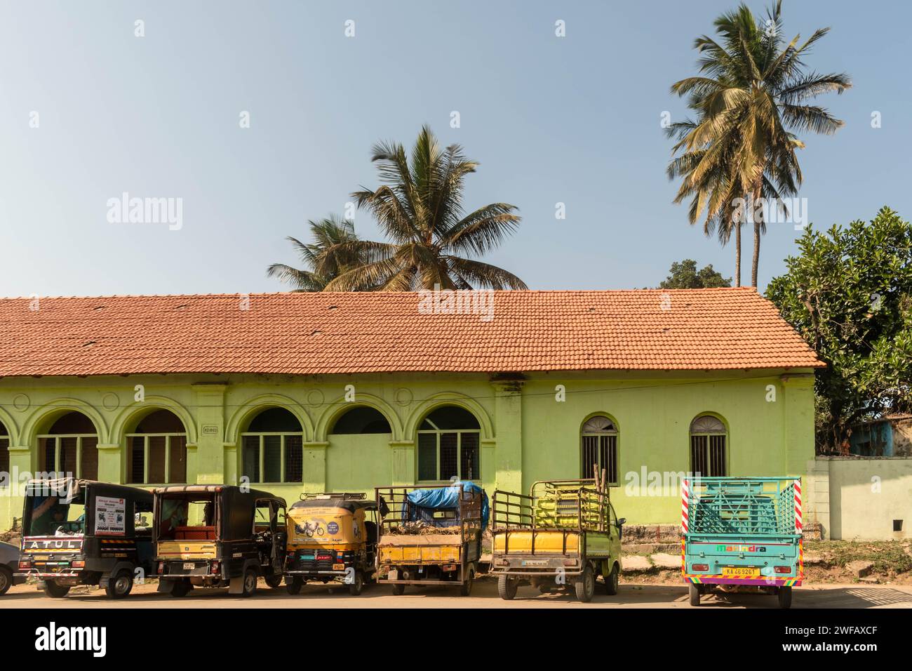 Belur, Karnataka, India - January 9 2023: Old fashioned architecture with green walls and gothic windows of a house. Stock Photo