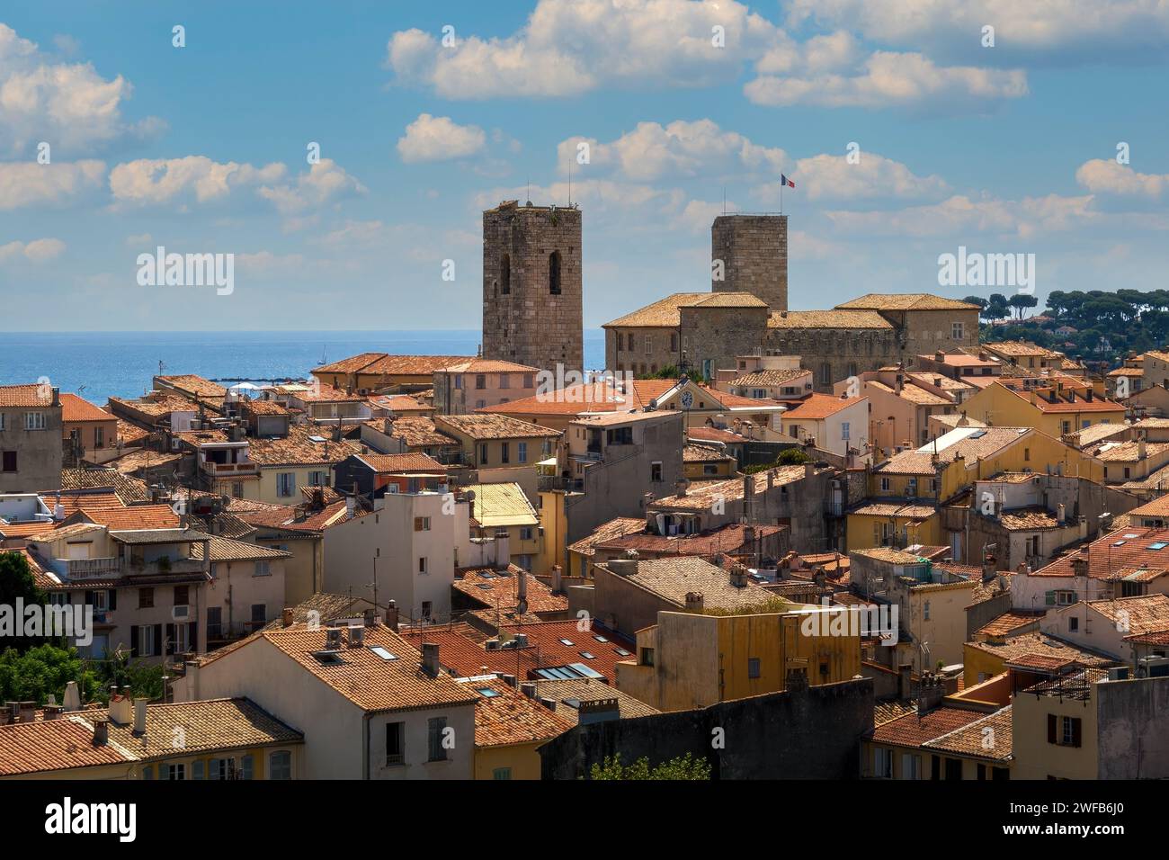 Aerial view of the red roofs, old houses and medieval towers of the old city of Antibes, France. Stock Photo