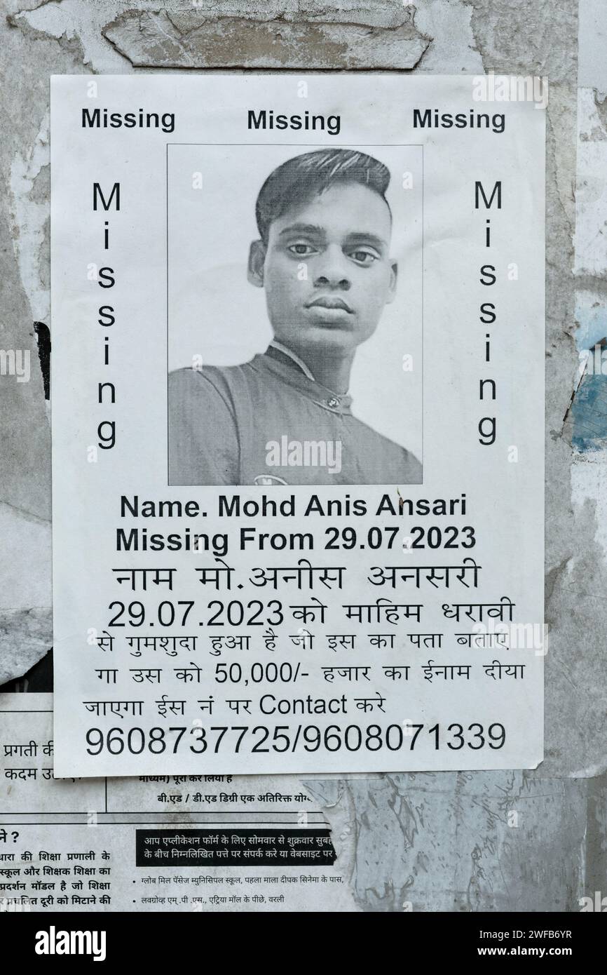 A poster in Mumbai, India, offering a reward of Rs. 50,000 for information on a missing person, a young Muslim male Stock Photo