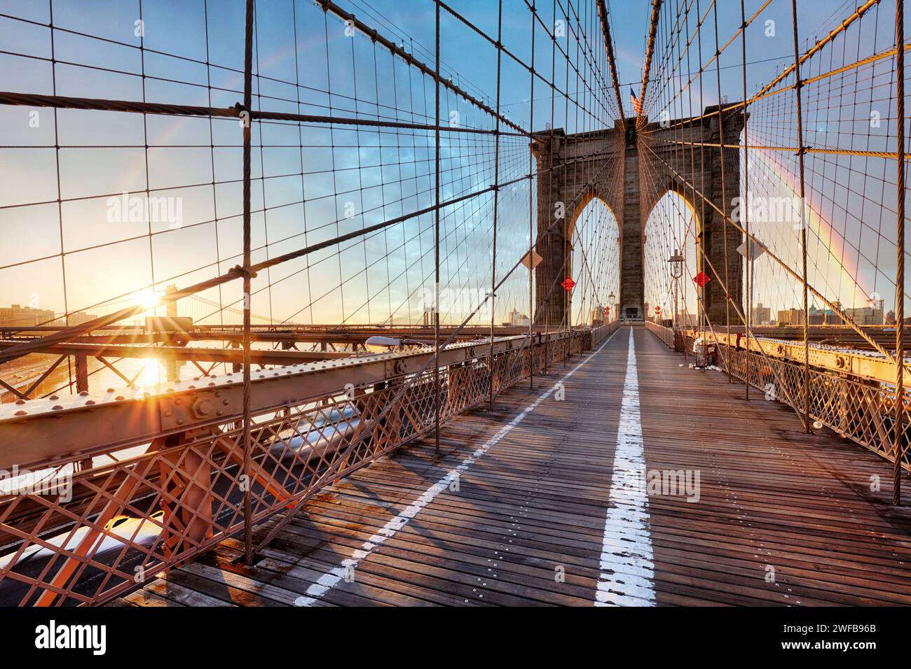 Rainbow over Brooklyn bridge in New York City at sunrise, USA Stock Photo