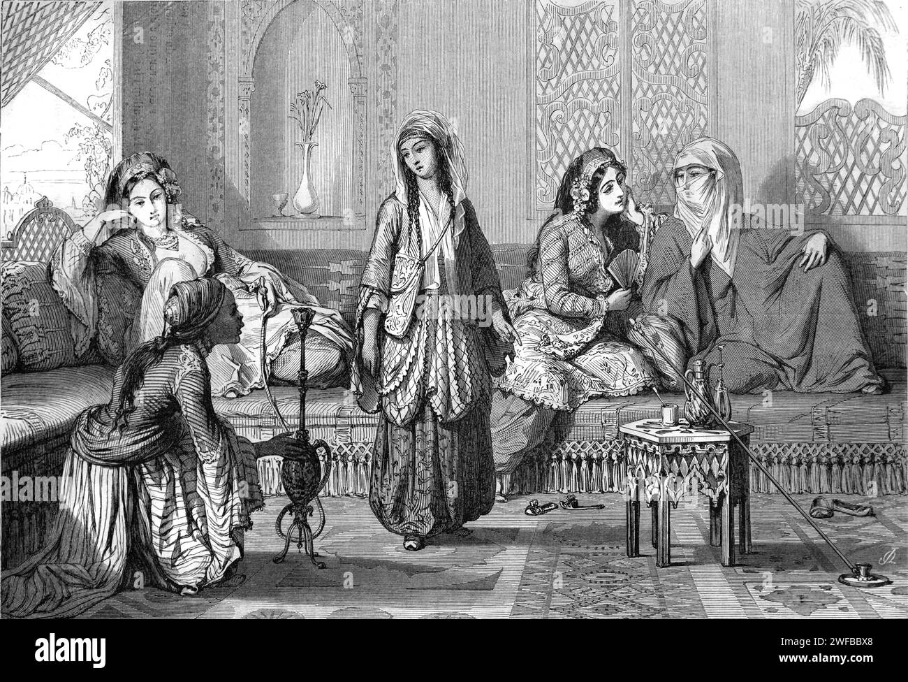 Turkish Women and African Servant or Slave with Waterpipe, Hookah or Narghile Reclining on Ottoam Sofa or Divan in the Harem of Topkapi Palace Istanbul Turkey. Vintage or Historical Engraving or Illustration 1863 Stock Photo