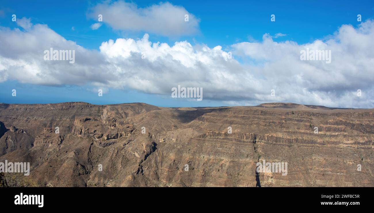 Mountains on the Canary Island of Gran Canaria in Spain, with blue sky and clouds Stock Photo