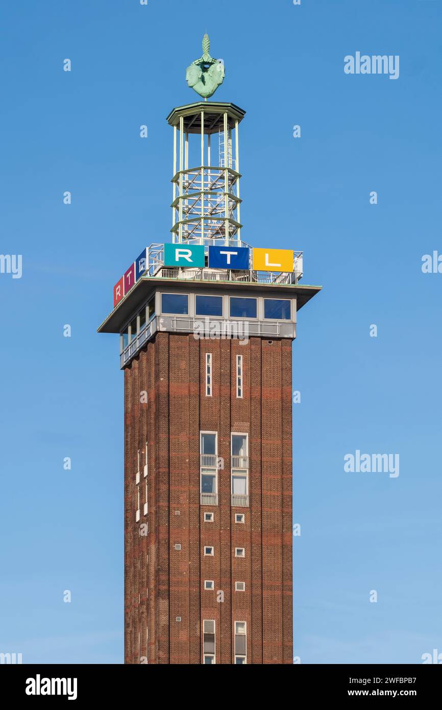Trade fair tower with the logos of RTL Radio Tele Luxemburg at the headquarters of the private broadcaster in Cologne's Deutz district. Stock Photo