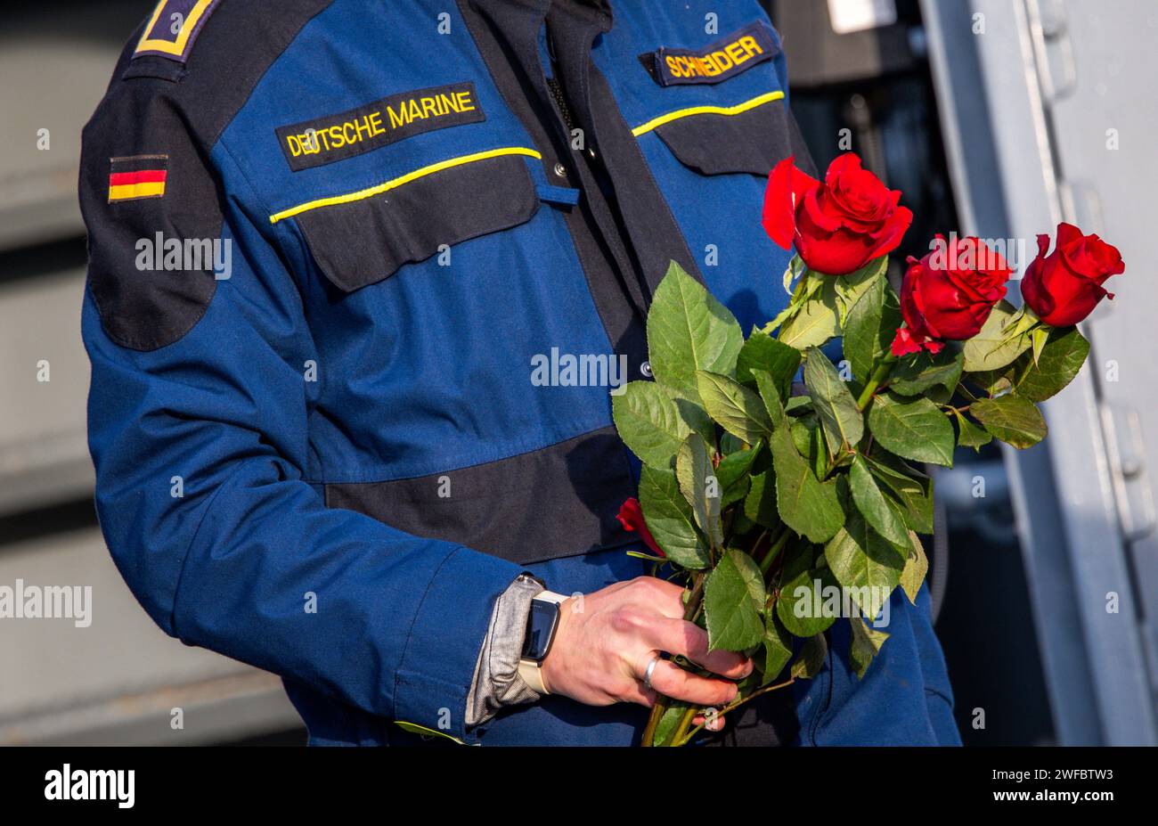 Rostock, Germany. 30th Jan, 2024. A crew member of the corvette