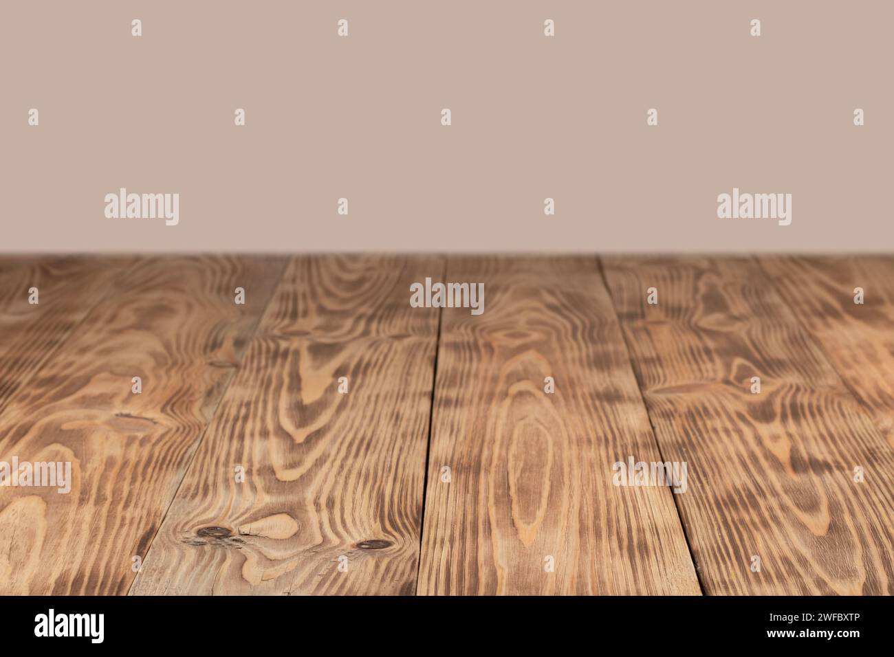 empty wooden table float up on beige background. Stock Photo