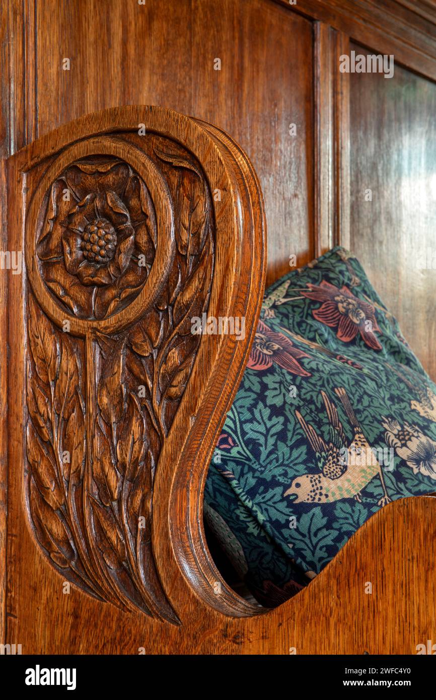 UK, Cumbria, Bowness on Windermere, Blackwell, Arts and Crafts House, Dining Room, carved detail of fireplace seat Stock Photo