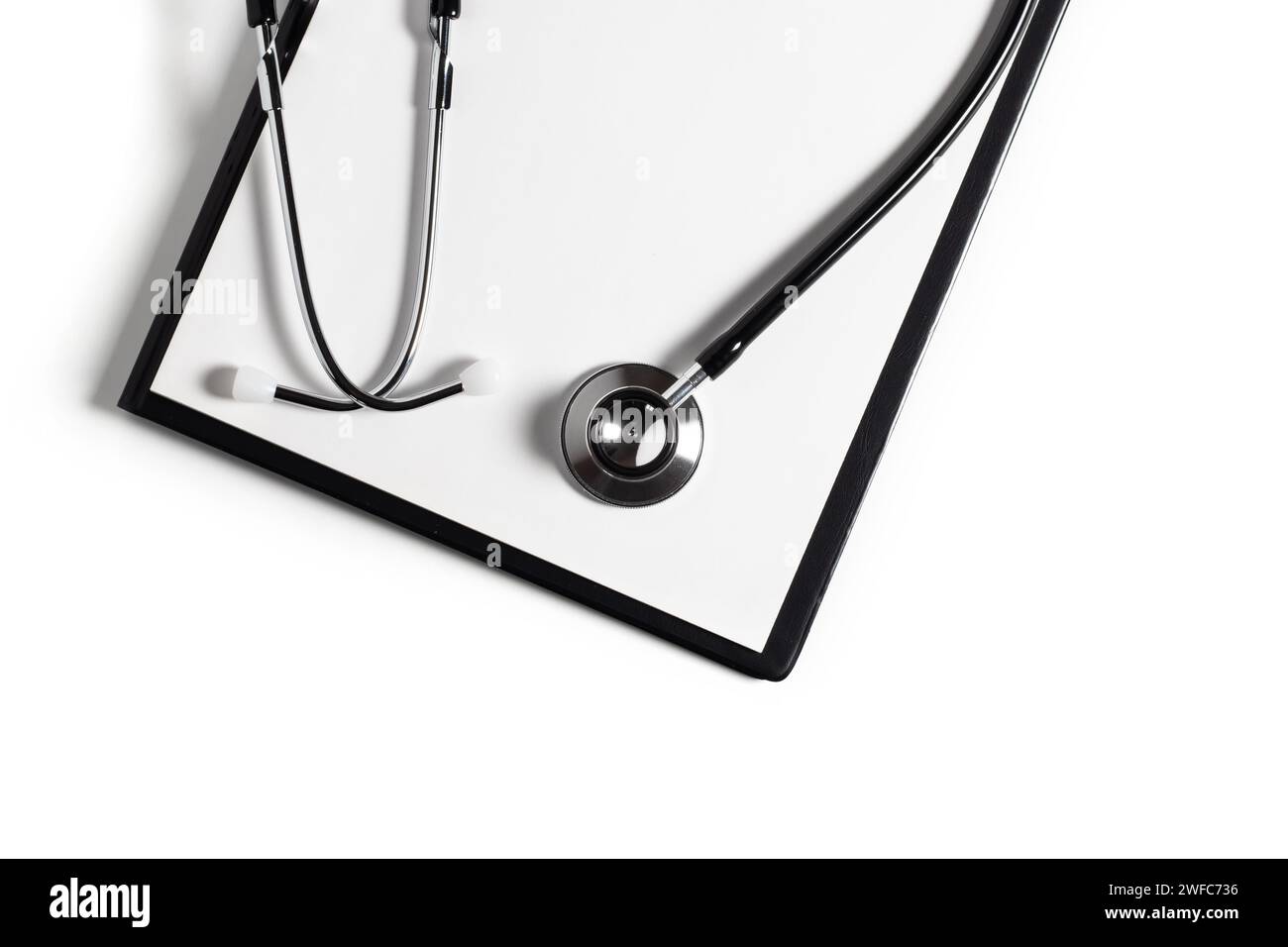 Blank clipboard with stethoscope on white background Stock Photo - Alamy