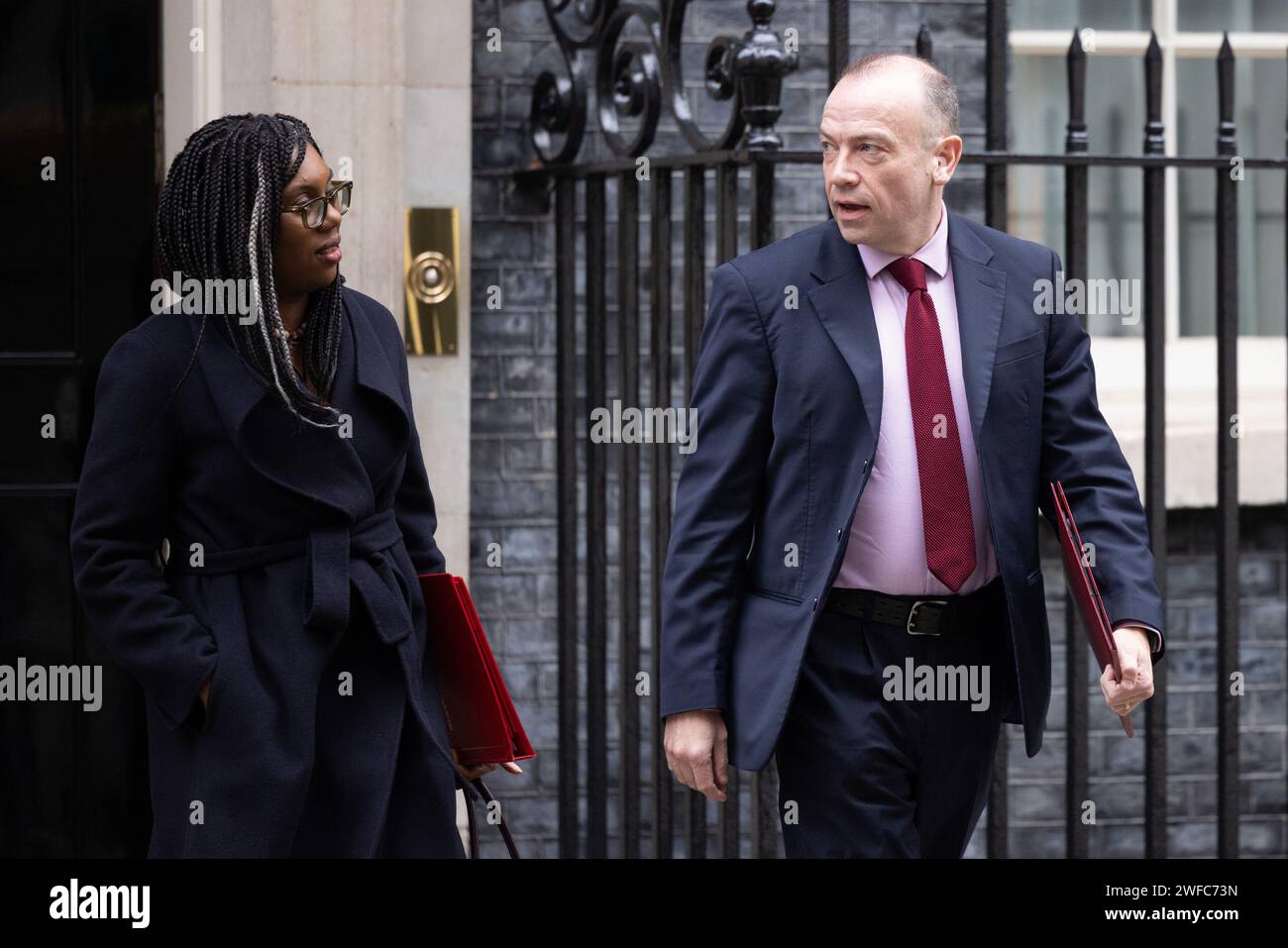 Downing Street, London, UK. 30th January 2024.  Kemi Badenoch MP, Secretary of State for Business and Trade and President of the Board of Trade and Minister for Women and Equalities, and Chris Heaton-Harris MP, Secretary of State for Northern Ireland, attend the weekly Cabinet Meeting at 10 Downing Street. Photo by Amanda Rose/Alamy Live News Stock Photo