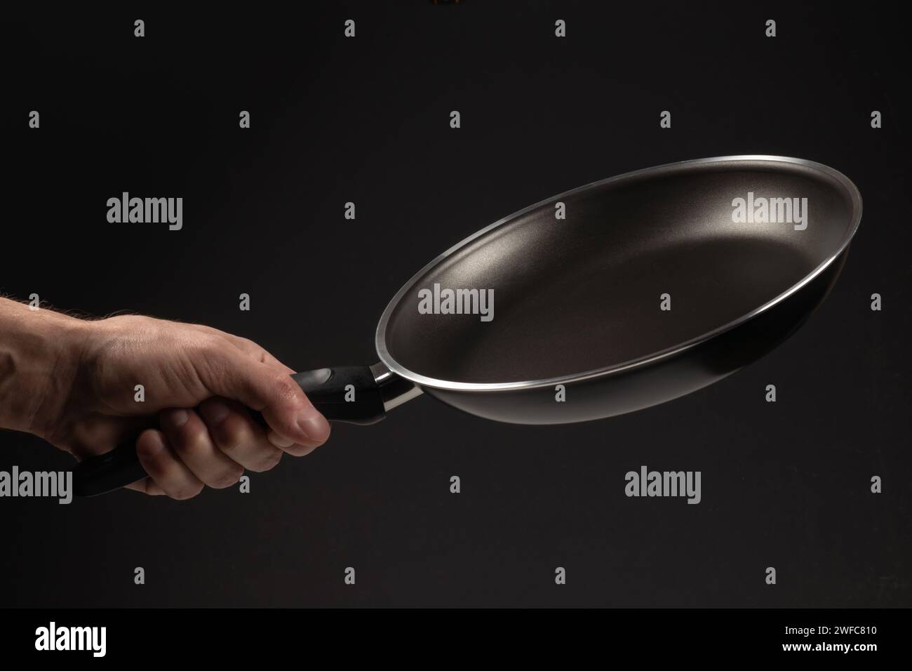 Deep Frying Hand Hand with frying pan hi-res stock photography and images - Alamy