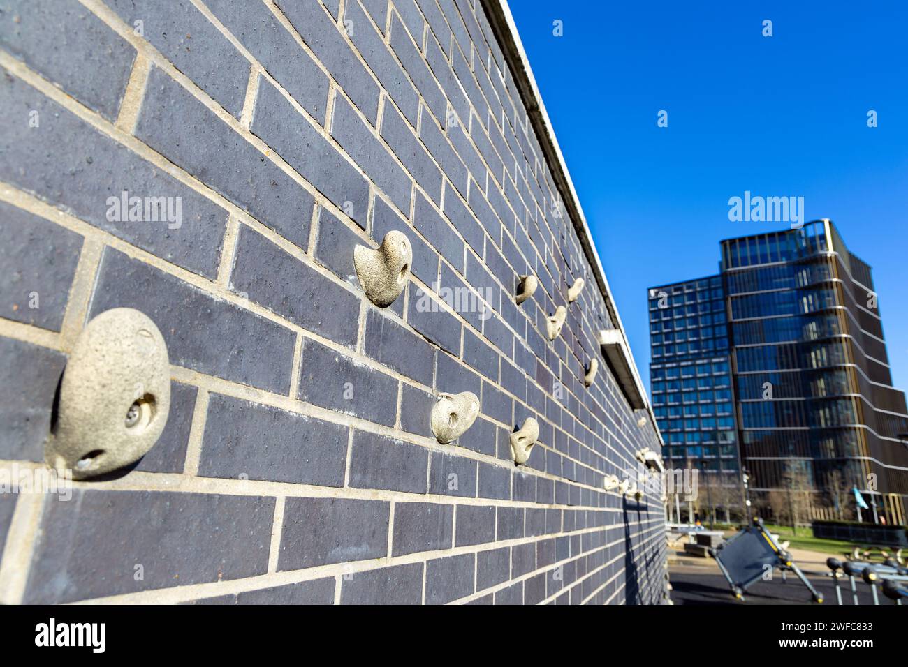 Urban climbing wall in the East Village, Stratford, London, England Stock Photo