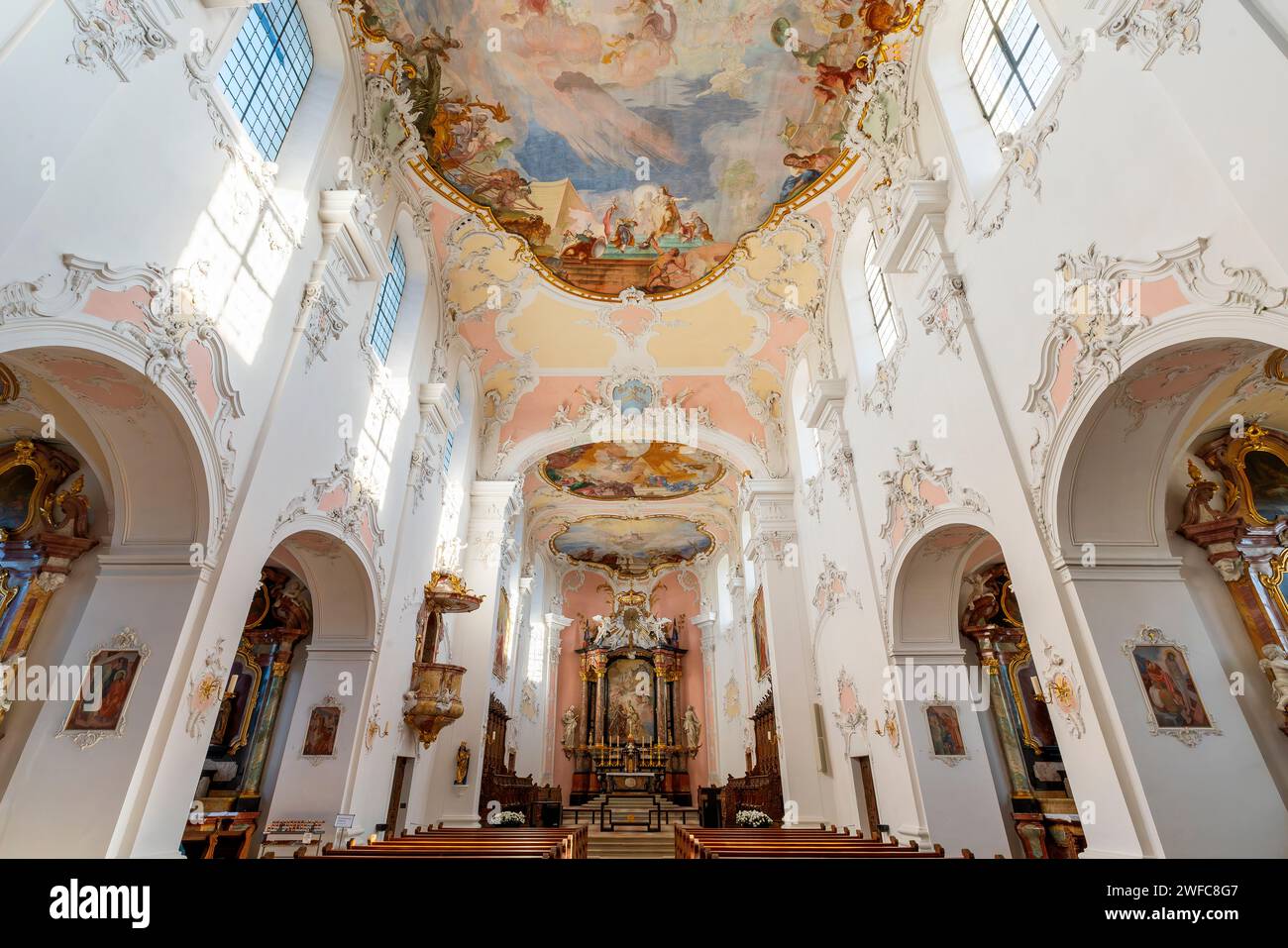 The main altar painting depicts the Royal couple Henrik II and Kunigunde presenting the new cathedral to Mary. Arlesheim, Switzerland.  The  Roman Cat Stock Photo