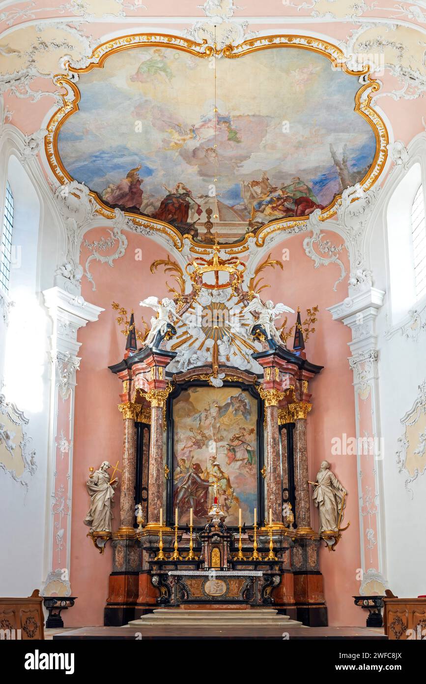 The main altar painting depicts the Royal couple Henrik II and Kunigunde presenting the new cathedral to Mary. Arlesheim, Switzerland.  The  Roman Cat Stock Photo