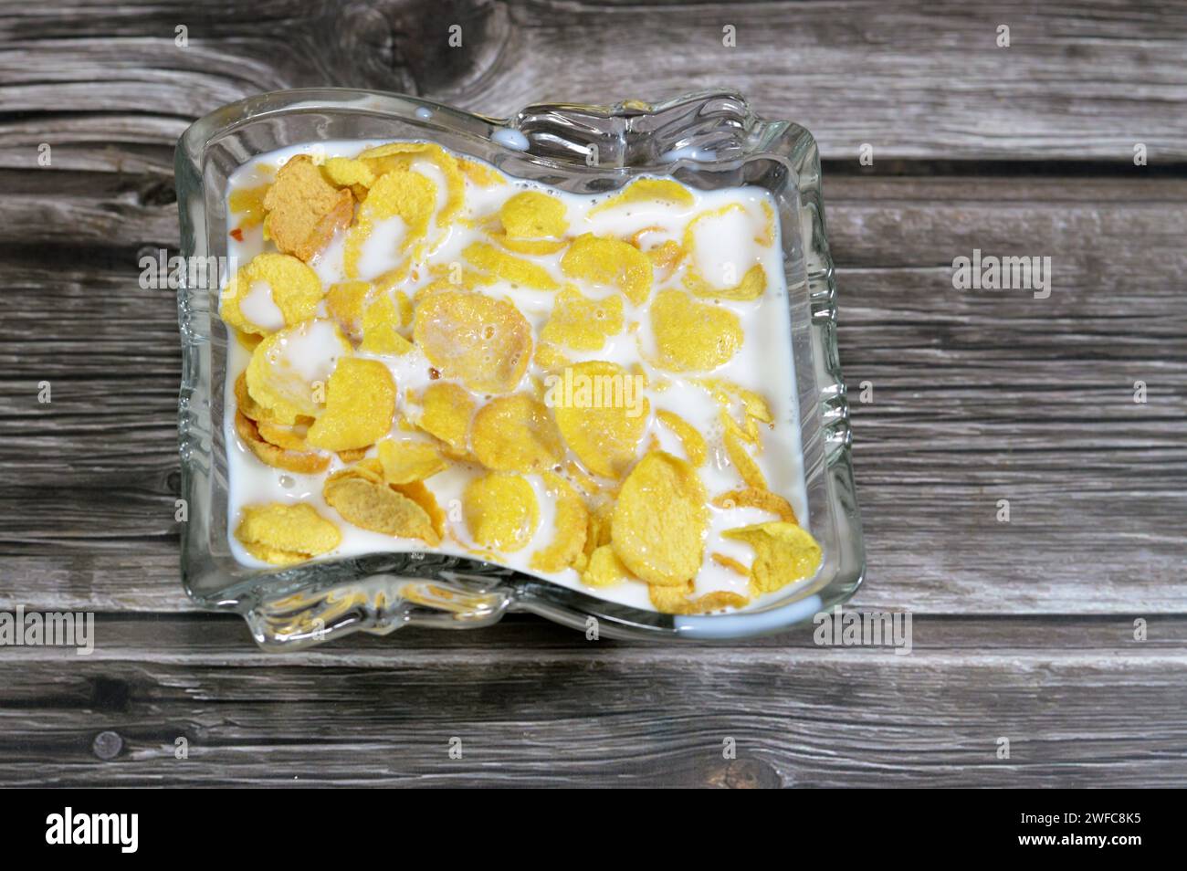 Milk with corn flakes, or cornflakes, a breakfast cereal made from