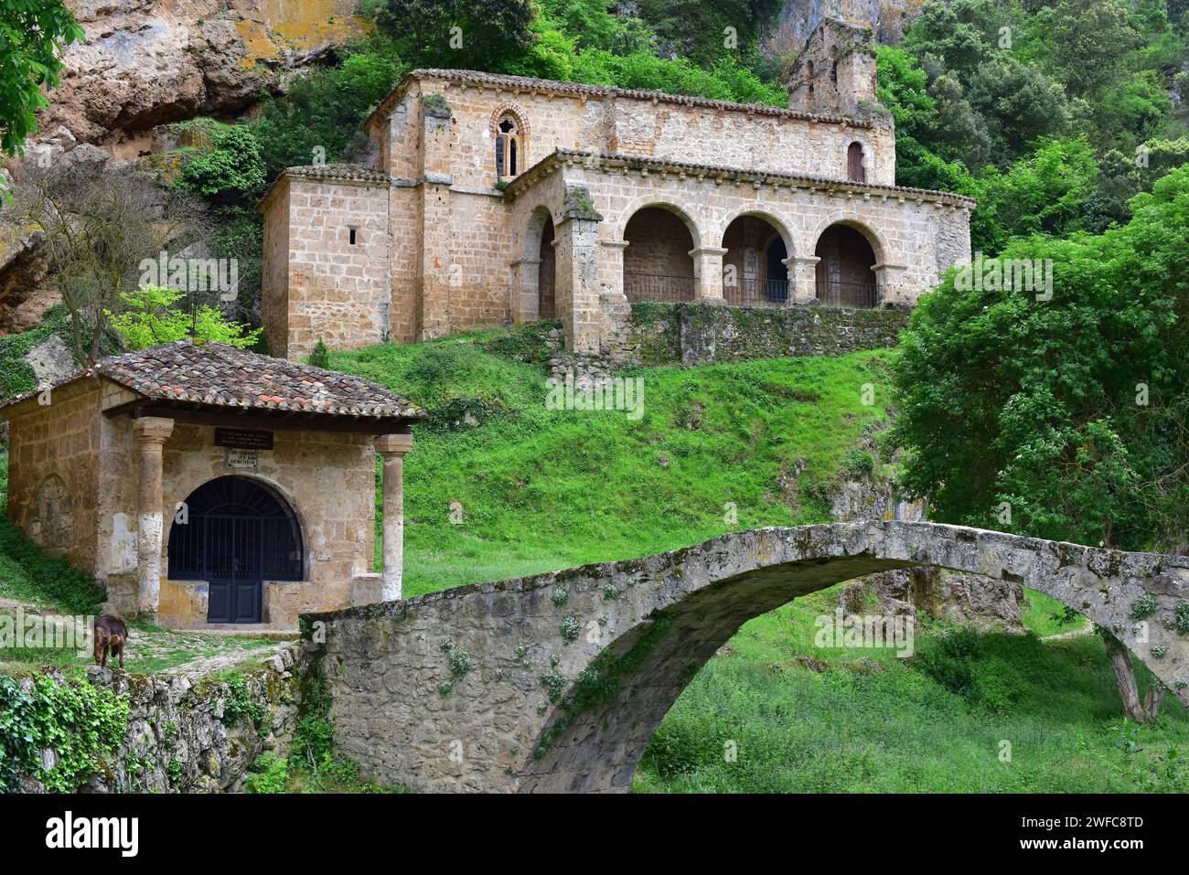 Santa Maria de la Hoz hermitage with medieval bridge and Santo Cristo chapel. Tobera, Burgos province, Castilla y Leon, Spain. Stock Photo