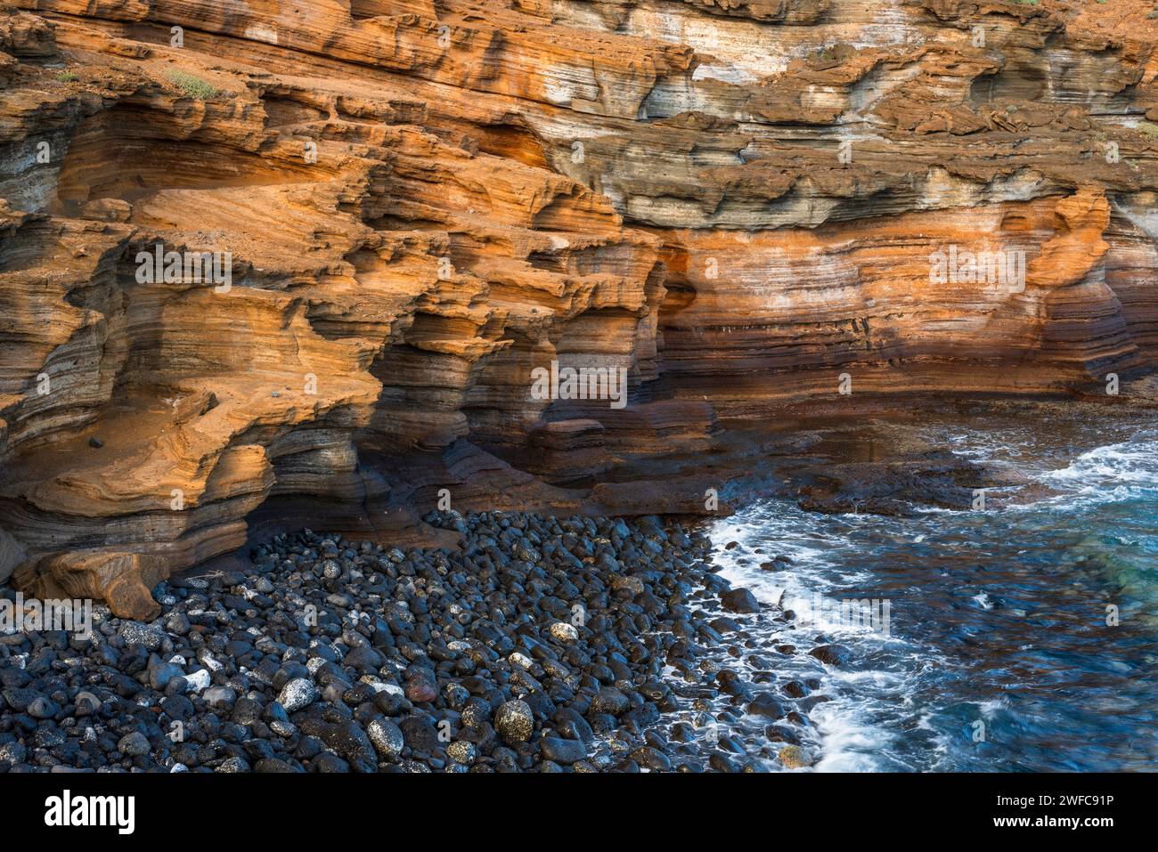 Detail weathered volcanic rocks forming the seaward side of the phreatomagmatic cone of Montana Amarilla, Costa del Silencio, Tenerife Stock Photo