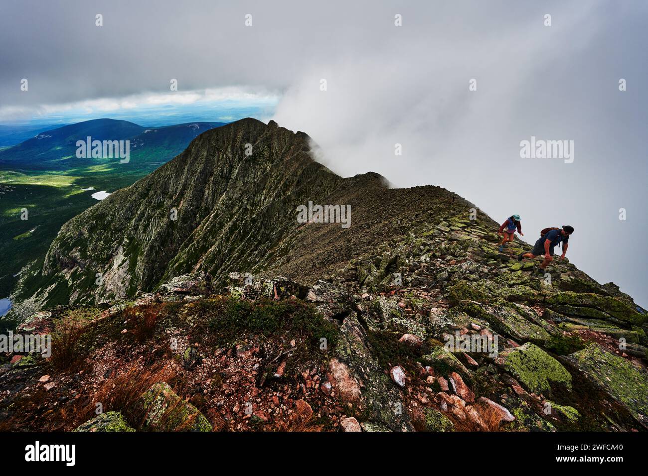 Two hikers hiking knives edge trail, Mount Katahdin, appalachian trail