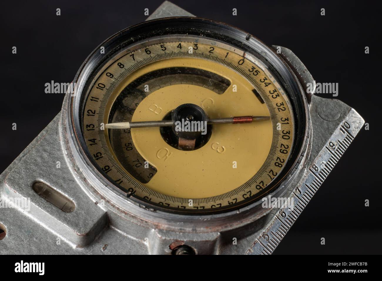 Old mining compass on dark background close up. Stock Photo