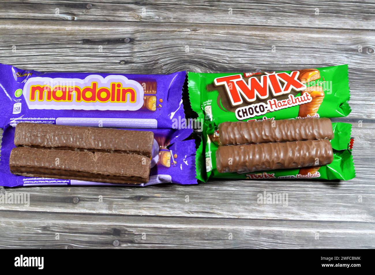 Cairo, Egypt, January 25 2024: Mandolin Biscuit Covered with Caramel and Chocolate, Cadbury Mandolin bars and new Twix Choco-Hazelnut caramel shortbre Stock Photo