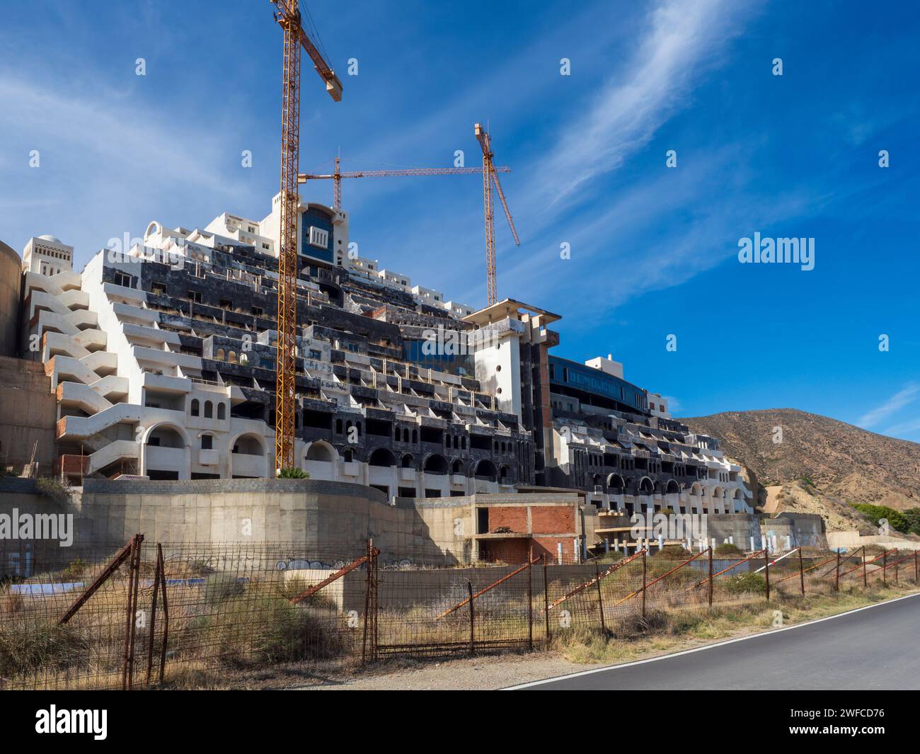 Illegal construction of the abandoned Algarrobico hotel in the natural park of Cabo de Gata in Carboneras, Almeria, Spain. Stock Photo